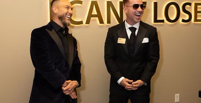 Mike Sorrentino and family at The Archangel Centers photo wall during the grand opening