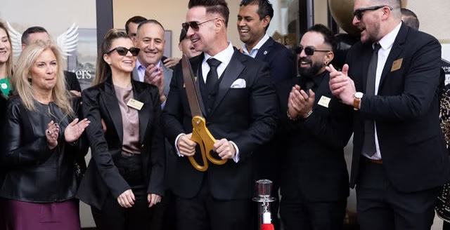 Ribbon-cutting moment at The Archangel Centers grand opening, second angle